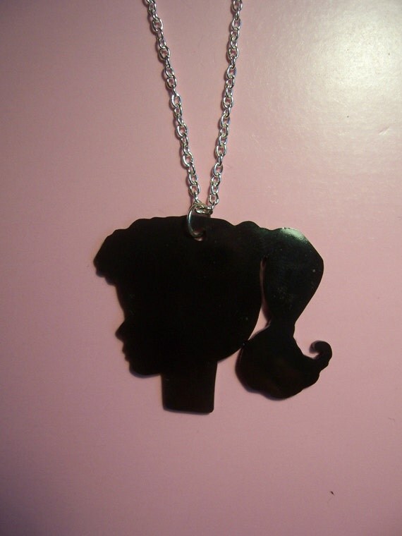 Items similar to Black Barbie head silhouette necklace on Etsy