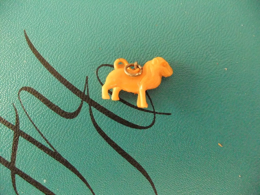 african lion  celluloid charm -  1930's  - 1940's - pendant - plastic - vintage - steampunk - altered art -jewelry - cracker jack -