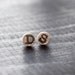 initial earrings.