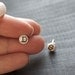 initial earrings.