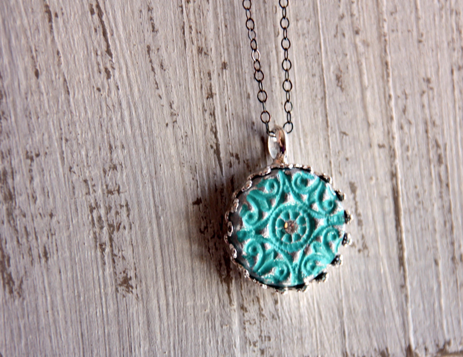 Turquoise and silver round pendant in setting on delicate oxidized sterling silver chain