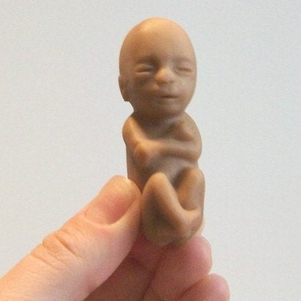 two creepy rubber fetuses, tan/pinkish