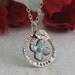 Dance - Regrowth Necklace with blue flower - in sterling silver with enamel on copper - by Kathryn Riechert