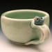 Sweet Little Blue Bird on a Pale Green Cup