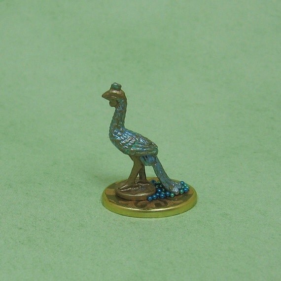 miniature peacock figurine