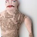 red-haired man with boat tattoo