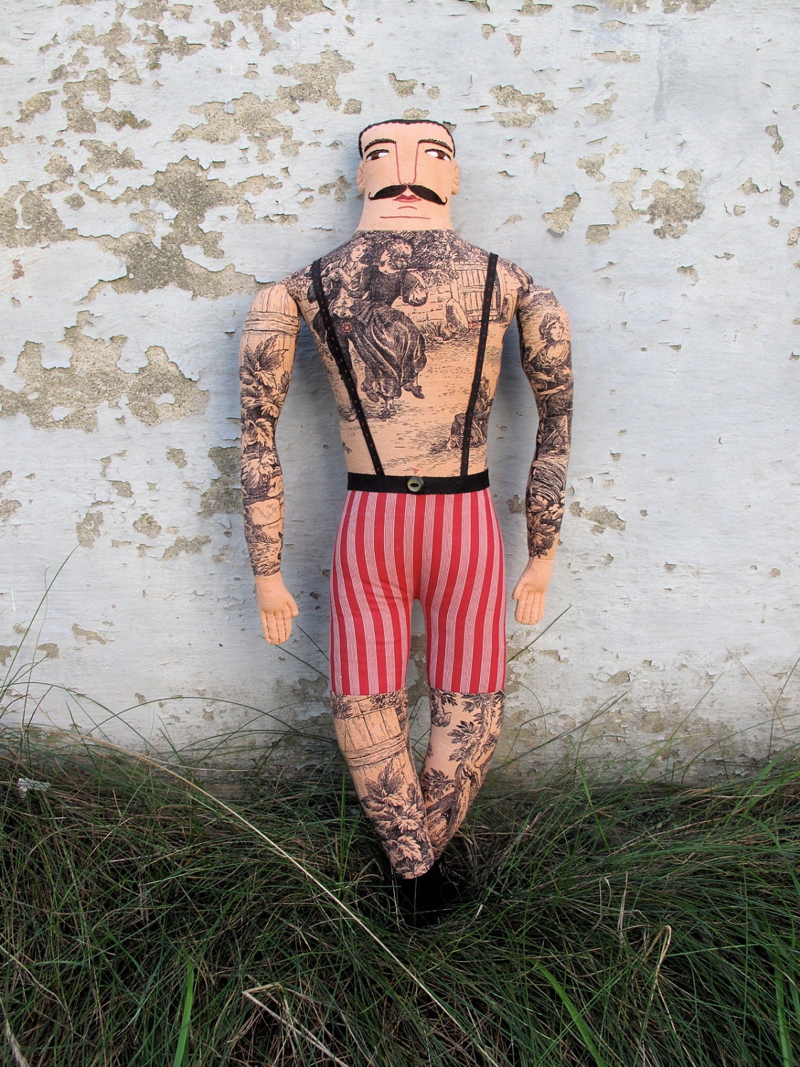 tattooed man doll