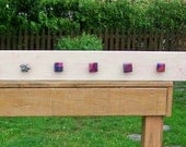 wooden wall peg board with dichroic glass knobs