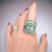 Sterling Silver Adjustable Eye Ring inlaid with Blue Green Iridescent Mosaic Polymer