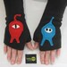 Ms.Pacman and her pursuer Black Adult Fingerless Gloves