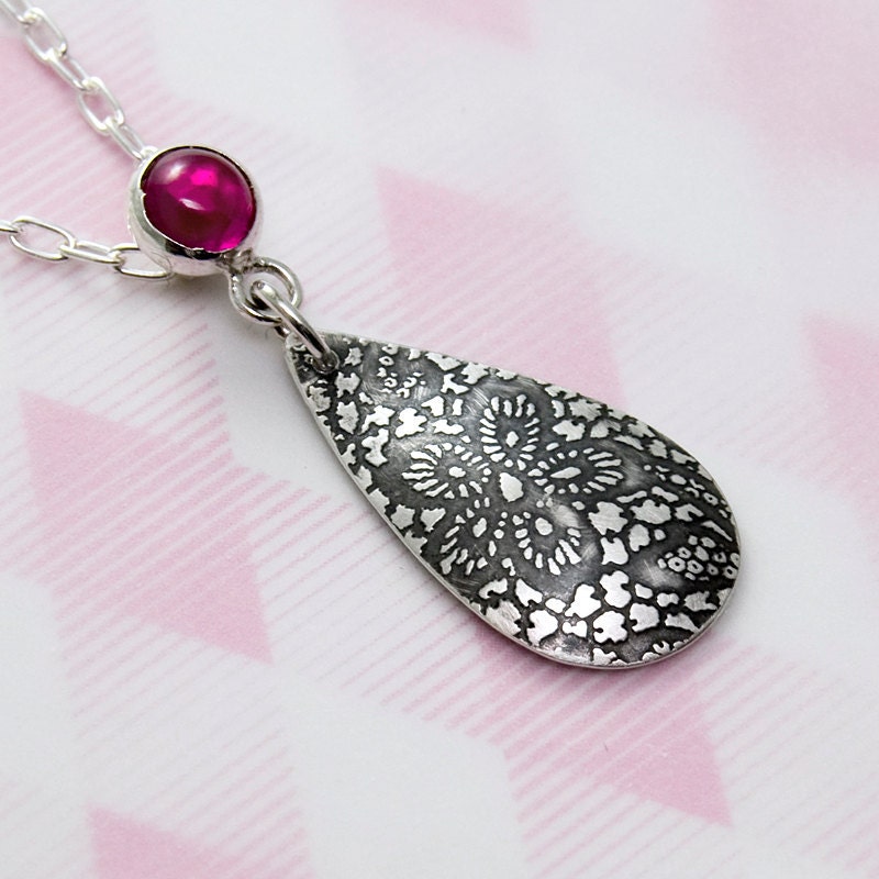 Lace etched teardrop pendant with ruby