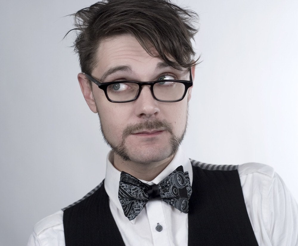 Men's black self-tie bow tie, "Exhaust Pipes" freestyle tie. Silkscreened automotive print necktie.