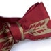 Burgundy Arrows bow tie, freestyle. Silkscreened necktie, antique brass print. "Quiver."