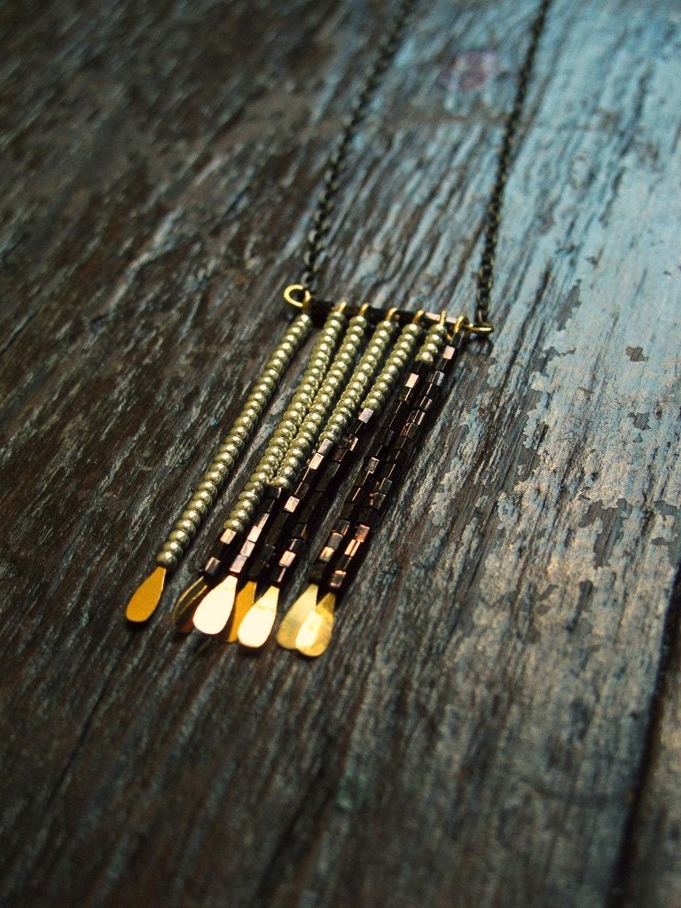 beaded necklace with colorblock in metallic bronze and silver tribal fringe