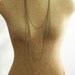 long minimal necklace with multi layered chains