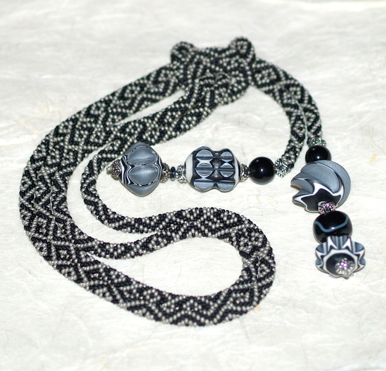 Madison Ave ... Bead Crochet Lariat . Rope Necklace . Matte Black . Silver . Lathe Turned Beads . Polymer Clay Focals . OOAK . Stylish