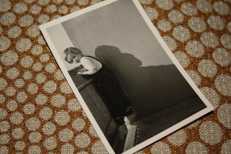 Little girl, little shadow. Original old photo.
