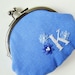 Personalized coin purse in blue with white initial and flowers
