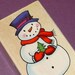 rubber mounted stamp / snowman holding tree . LAST one in stock