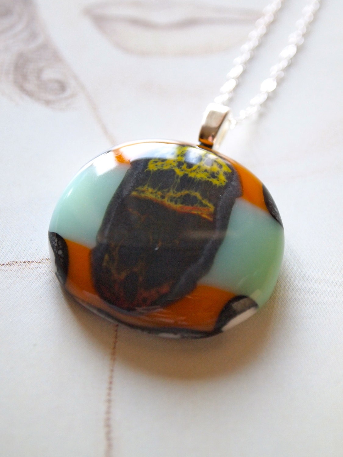 A stone's throw: Fine fused glass pendant on a fine sterling chain