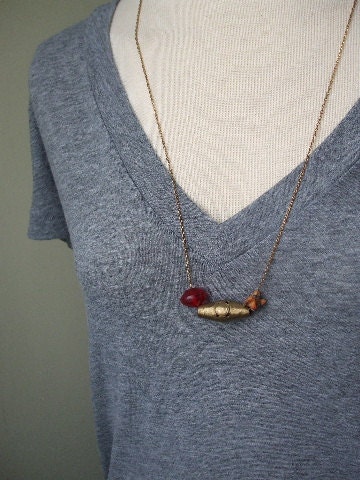 Antique brass, red glass and snake vertebrae necklace