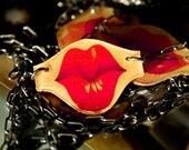 Kiss. Red Lips in Motion Pucker and Smile Vampy Necklace.