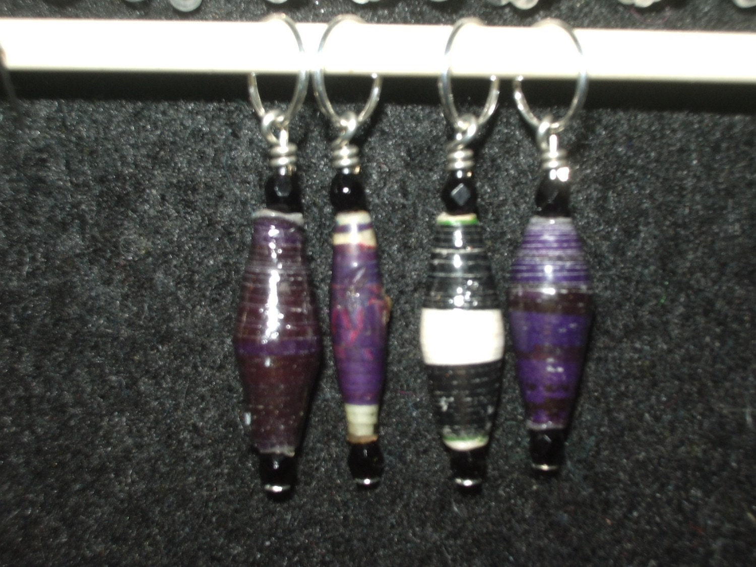 Mixed color purple and black stitch markers made with Beads for Life beads and jet black crystal - set of 4