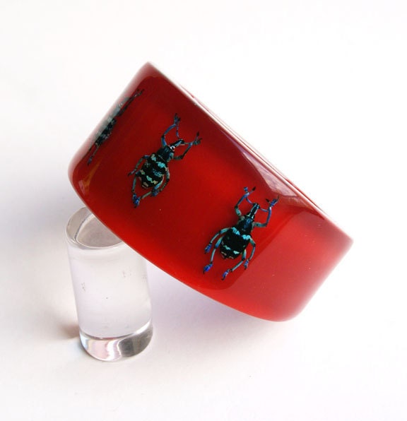 Red lucite bangle with real beetles