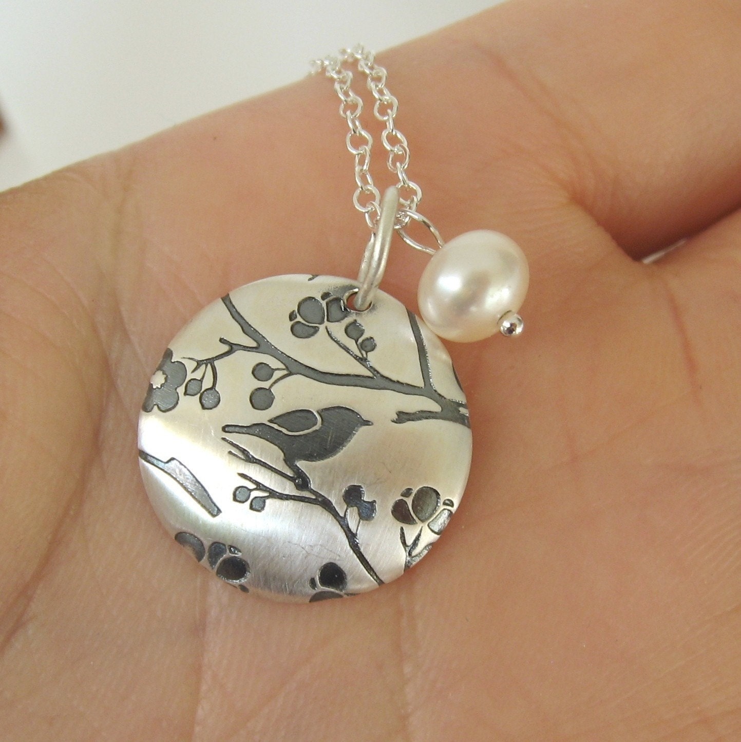 Song bird print on cherry blossom round sterling silver pendant