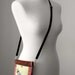 Alphons Mucha "Reverie" sling pouch with long shoulder strap. Copper pure silk backing.