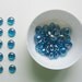 12 Glass Gems Iridescent Sky Blue in a Square Can