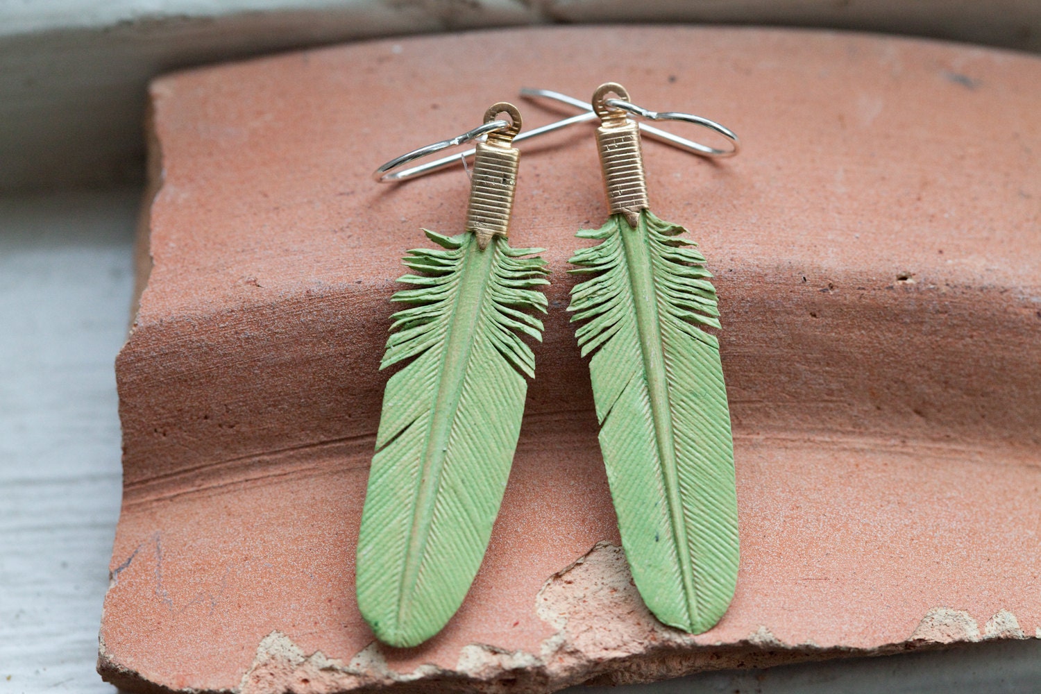small mint green leather feather earrings