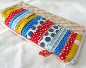 Red, yellow, blue pieced front. :Sunglasses Eyeglass case, (padded) zipper pouch. flat box bottom