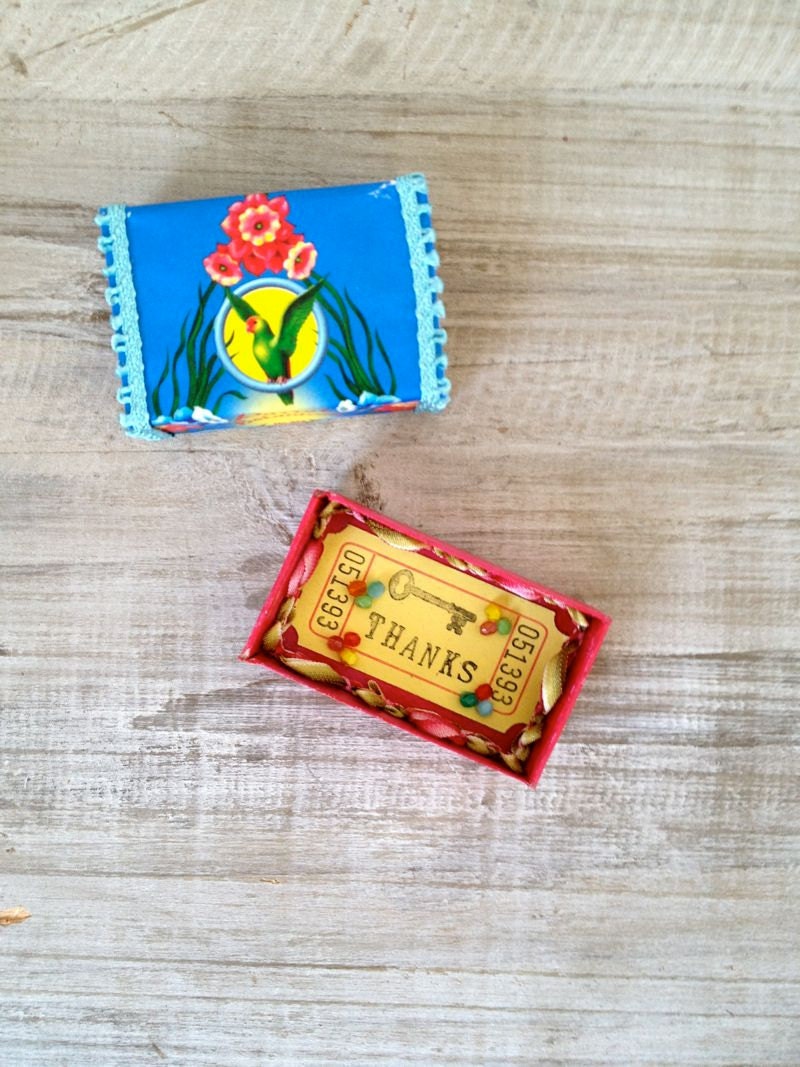 Altered vintage matchbox with a tropical bright greeting inside