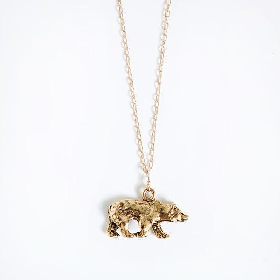 gold bear charm long necklace .    gold plated chain .