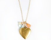 heart locket necklace  .  peach  . blue  .