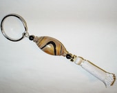 Keyring with polymer clay focal bead black and gold waves