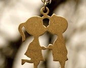 Boy and Girl Kissing 1960s Necklace