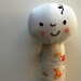 Baby on a Stick--Rattle in White Reproduction Feedsack Children Print