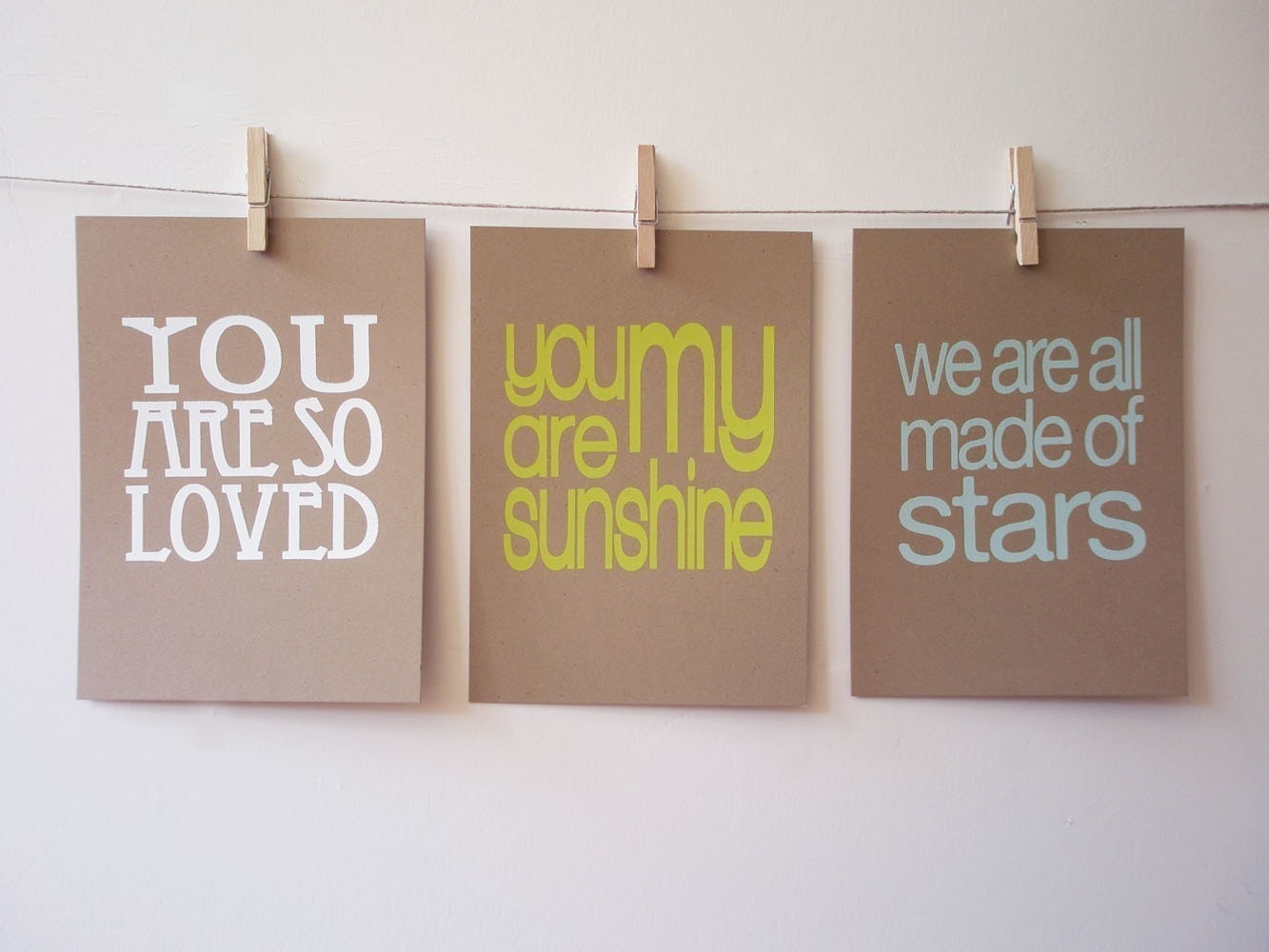 set of 3 screen prints on brown kraft stock