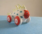 Rolling Red Cat Fish  - miniature sculpture on wheels