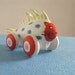 Rolling Red Cat Fish  - miniature sculpture on wheels
