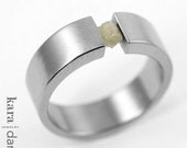 raw diamond tension set in stainless steel. ring