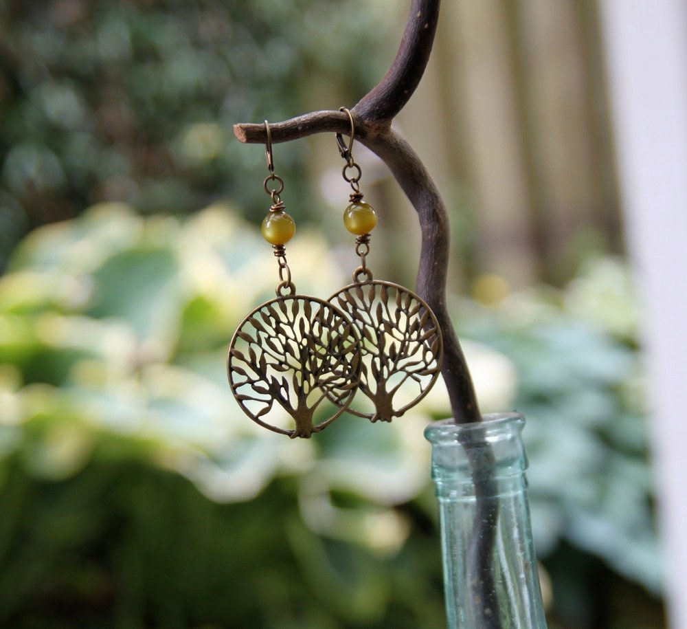 rooted earrings . olivine green