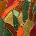 Swirling in from the outside a stained glass panel
