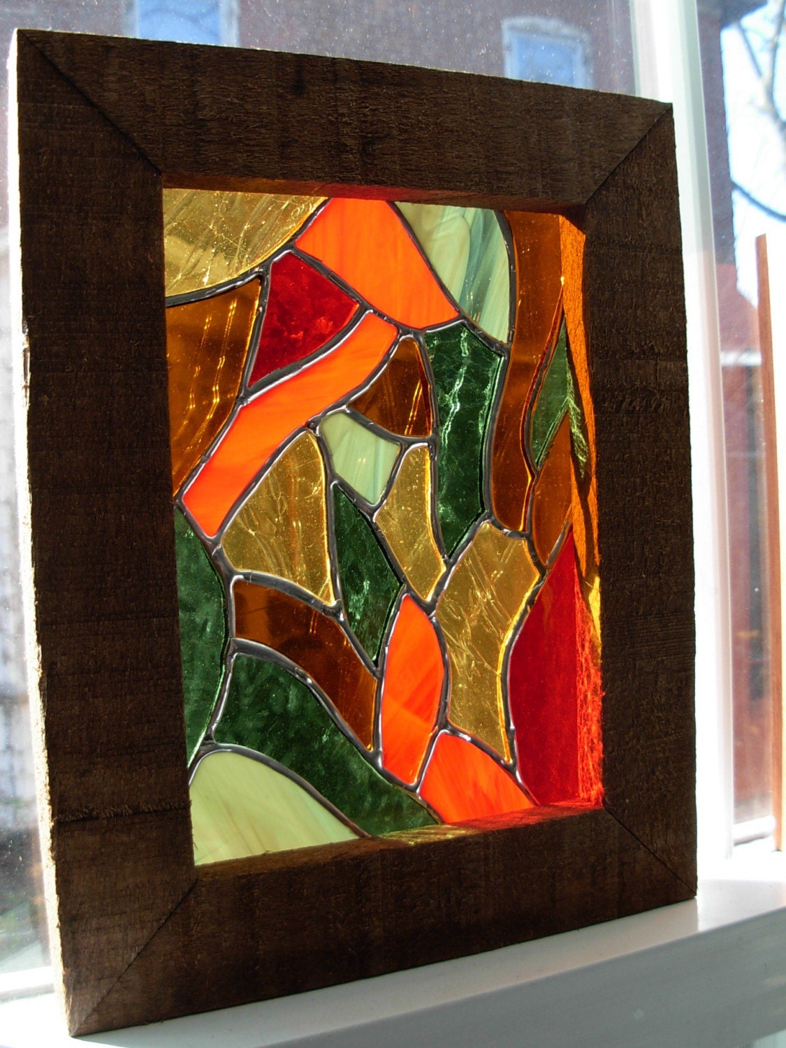 Swirling in from the outside a stained glass panel