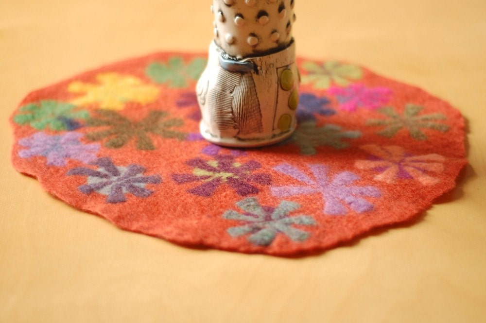 orange pin wheel round table runner