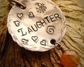 Laughter stamped word copper pendant