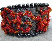 hana-bi-- black, red and orange beadwoven cuff bracelet