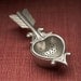 heart tea strainer with rest - hand cast pewter